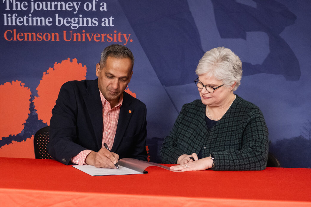 Anand Gramopadhye, dean of Clemson University's College of Engineering, Computing and Applied Sciences, and Candice Lewis, chief academic officer at Greenville Technical College, sign the articulation agreement.