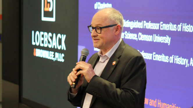 Nicholas Vazsonyi speaks into a microphone