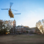 A Chinook helicopter flies over Bowman field.