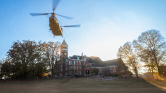 A Chinook helicopter flies over Bowman field.