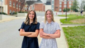 Clemson's 2026 Duckenfield Scholars: Olivia Oefinger and Ellisen Berry posing together outside the Honors Center on Clemson campus.