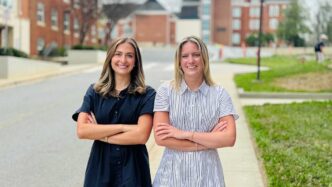 Clemson's 2026 Duckenfield Scholars: Olivia Oefinger and Ellisen Berry posing together outside the Honors Center on Clemson campus.