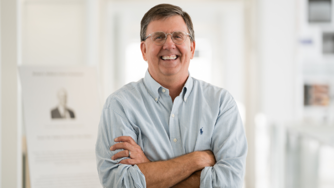 John Gaber, director of city and regional planning program. Smiling at the camera in the center of the photo.