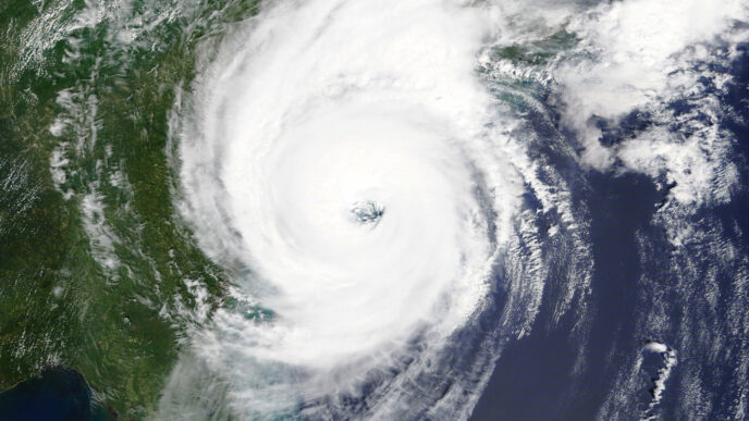 A hurricane, as viewed from space, approaches the east coast of the United States.