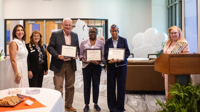 Representatives from the Daughters of the American Revolution present an award to Clemson faculty and staff members