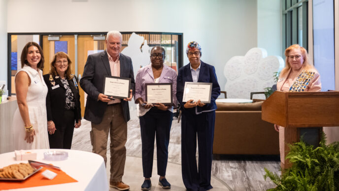 Representatives from the Daughters of the American Revolution present an award to Clemson faculty and staff members