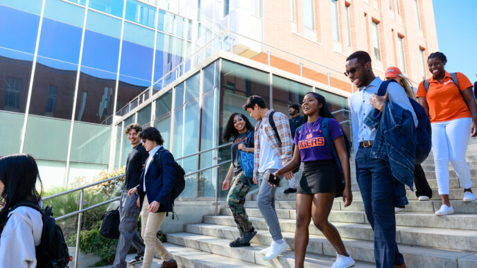 Students walking down the steps of the Wilber O. and Ann Powers College of Business.