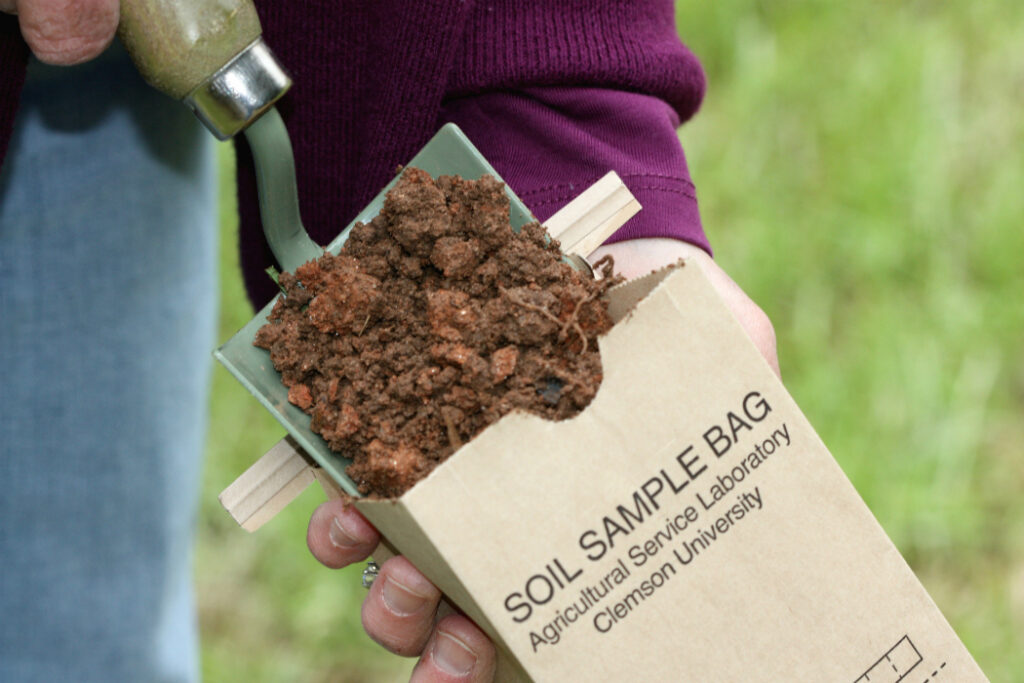 Soil sample bag being filled