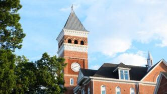Tillman Hall against a blue sky.