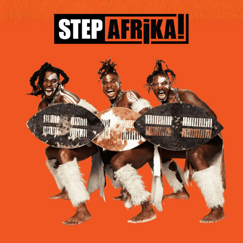 Three male members of Step Afrika strike a lively pose in costume against a bright orange backdrop.