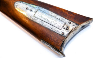 The butt of an historic rifle that bears the name of John DEwing Calhoun, the father of John C. Calhoun's wife.