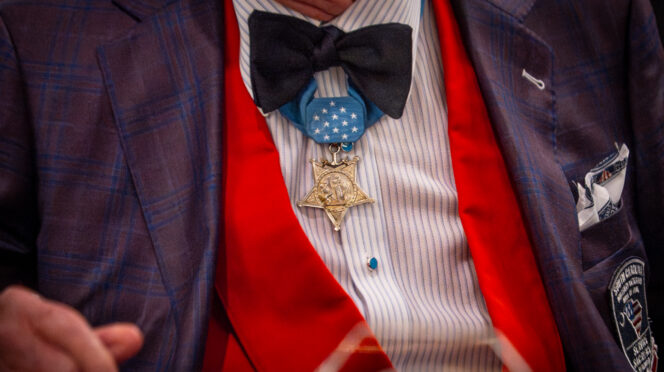 Close-up of a Medal of Honor pinned under the bowtie on a formal suit