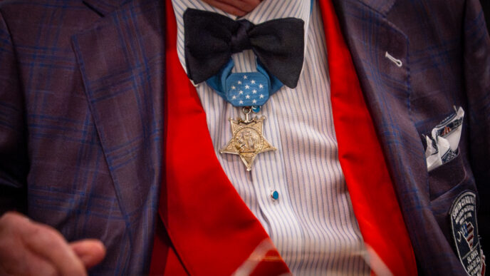 Close-up of a Medal of Honor pinned under the bowtie on a formal suit