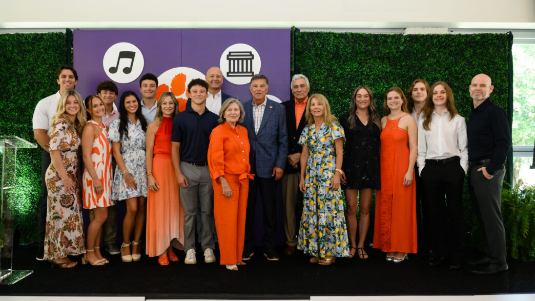 Bob and Kaye Stanzione with family on stage at celebration