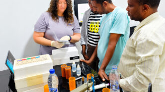 Shannon Alford, director of the Clemson Regulatory Agricultural Service Laboratory, reviews pH electrode calibration and use with the staff at a new soil-testing laboratory in Woliso, Ethiopia.