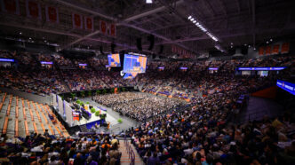 A full crowd of people attend Commencement at Clemson University in Littlejohn Coliseum