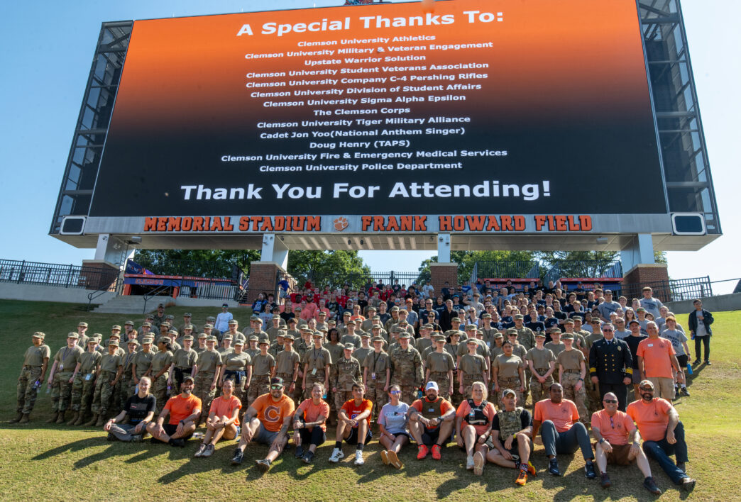 Participants and organizers of the 2025 Memorial Stair Climb gather for a group photo on the Hill in Memorial Stadium