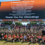 Participants and organizers of the 2025 Memorial Stair Climb gather for a group photo on the Hill in Memorial Stadium