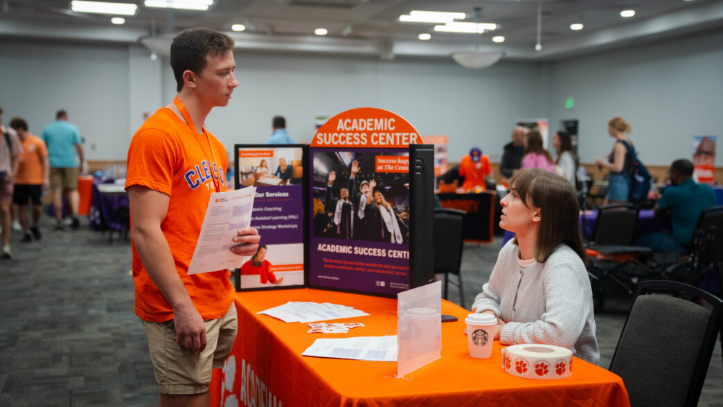 A student meets with a representative from the Academic Success Center