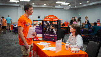 A student meets with a representative from the Academic Success Center