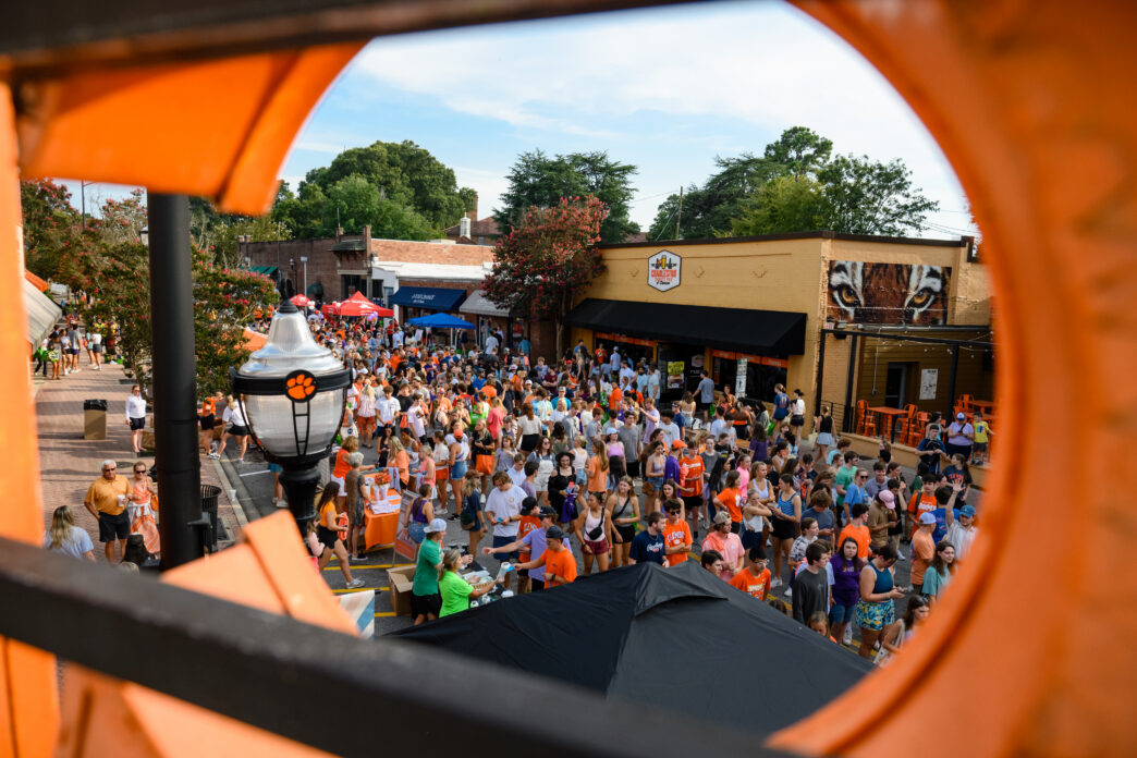 Students interact with each other and vendors on College Avenue in downtown Clemson