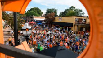 Students interact with each other and vendors on College Avenue in downtown Clemson