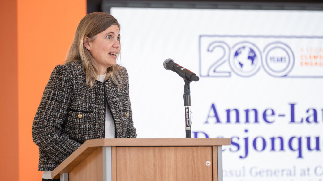 Anne-Laure Desjonquères speaks at a lectern.