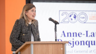 Anne-Laure Desjonquères speaks at a lectern.