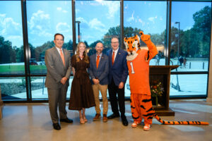 16th president of Clemson University, Dr. Benjamin Ayers, FEC student Madison Tankersley, FEC department chair and professor Kyle Barrett and CAFLS dean Matthew Holt pose with the Tiger mascot at the ribbon cutting and dedication of the new Forestry and Environmental Conservation building.