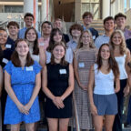 The Lyceum Scholars standing on the stairs of the Powers building.