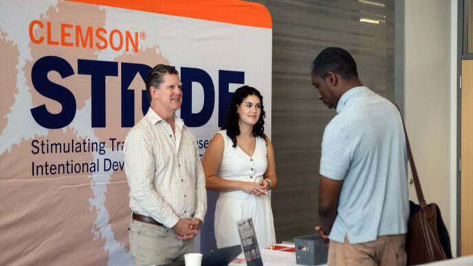 STRIDE personnel meet a new faculty member at New Faculty Orientation.