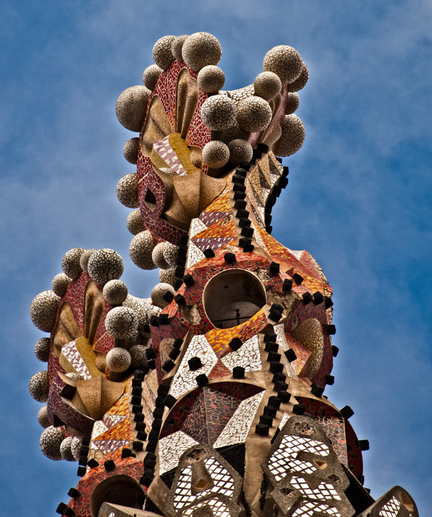 A spire covered in spheres and other complex shapes and patterns.