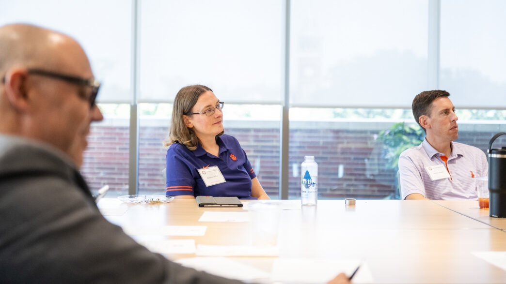 New Chair Orientation attendees listen at a table.
