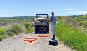 Clemson University doctoral student Akshit Suthar uses pool noodles, fiberglass driveway markers, wire and zip ties to develop a platform to carry autonomous recording units into remote wetlands to study wildlife.