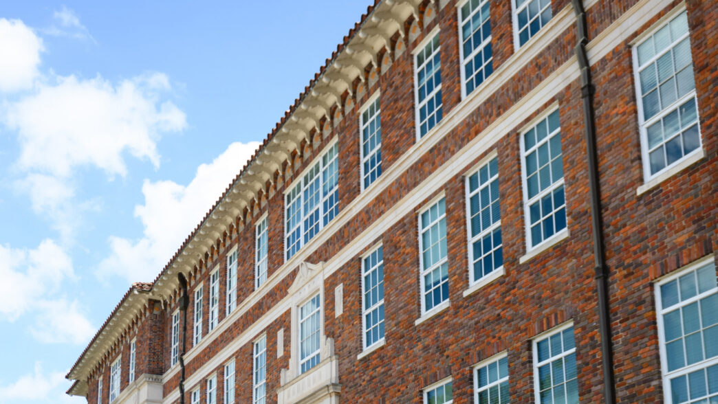The top portion of Long Hall in front of a blue sky.