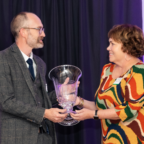 Brent Morris accepts a a glass award from SC Humanities