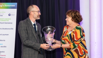 Brent Morris accepts a a glass award from SC Humanities